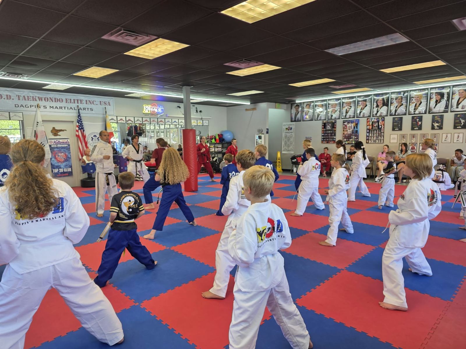 Kids practicing kicking drills during a class at MOD Taekwondo Harrisville